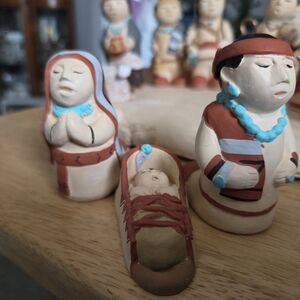 Handcrafted Clay Figurine Set with Red and Blue Accents